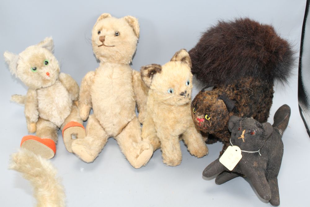 A collection of nine assorted vintage and later soft toy cats including Steiff